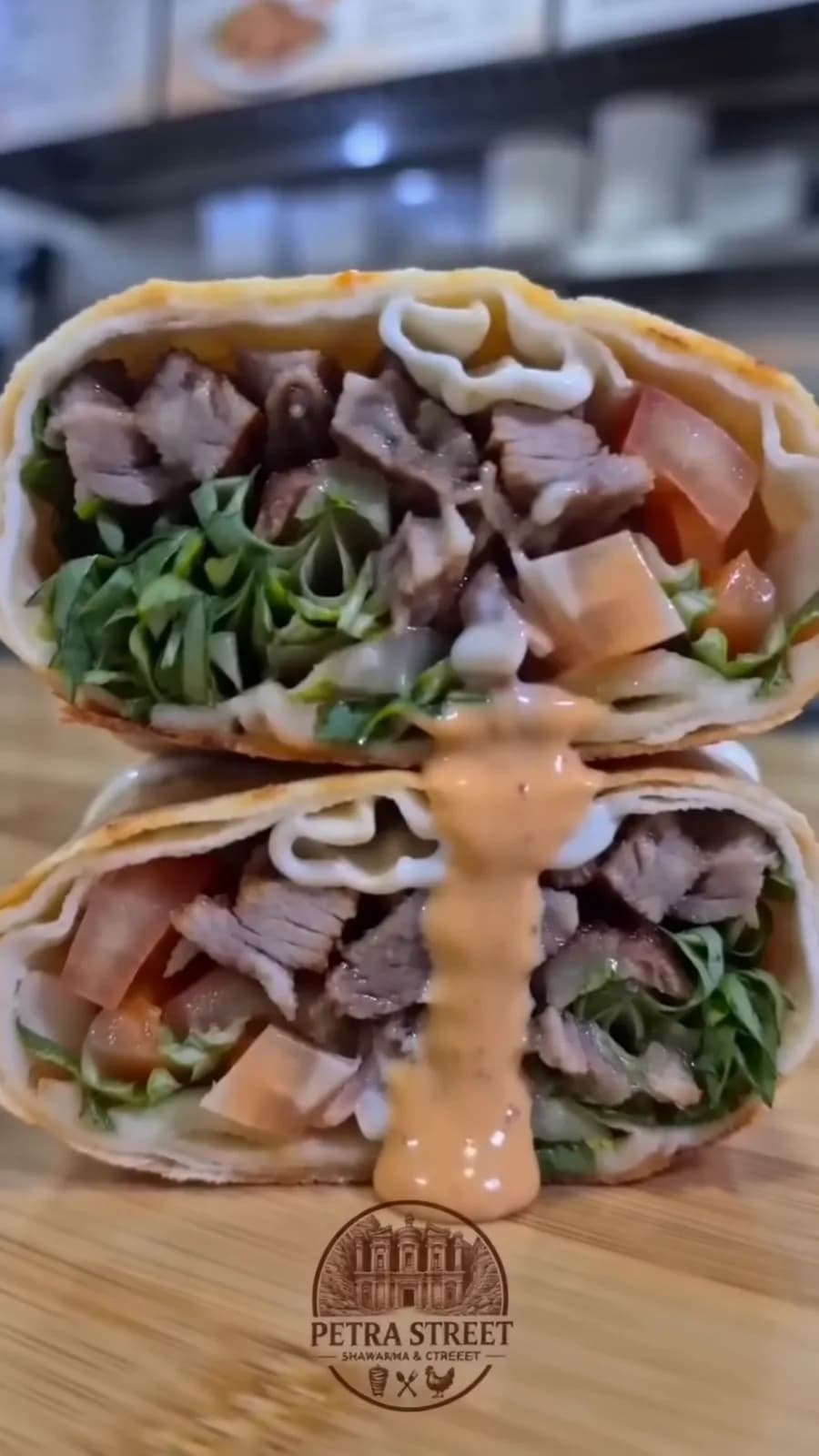 A finished shawarma wrap cut in half